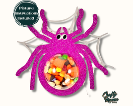 a purple spider with candy in it's mouth