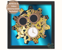 a picture frame with a clock and gears on it