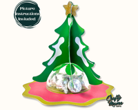 a paper christmas tree with candy wrapped in foil