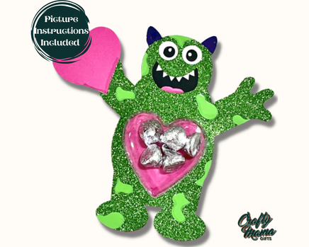 a green monster holding a pink heart