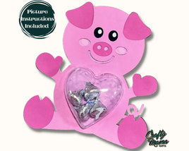 a pink pig holding a heart filled with candy