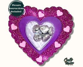 a purple heart shaped box filled with chocolates