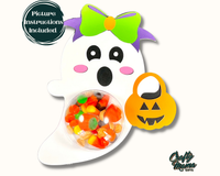 a halloween decoration with a ghost holding a candy bowl