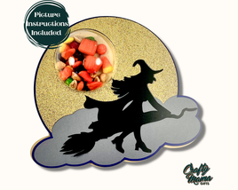 a silhouette of a witch on a broom with a bowl of candy