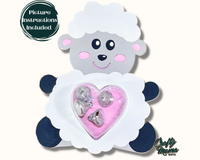 a white sheep holding a pink heart shaped object