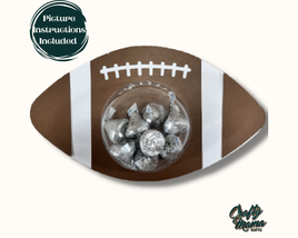 a football shaped candy bowl with chocolate candies in it