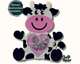 a cow holding a heart shaped candy box