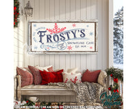 a sign on a wall that says frosty&#39;s snowflake cafe