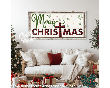 a merry christmas sign hanging on a wall above a couch