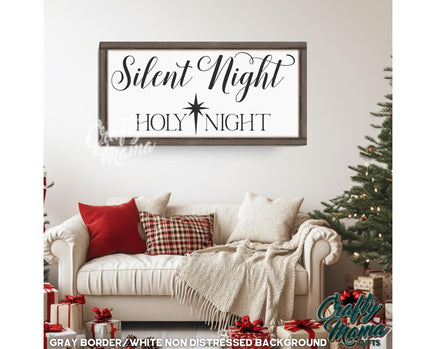 Silent Night sign in a living room with a white couch and a christmas tree