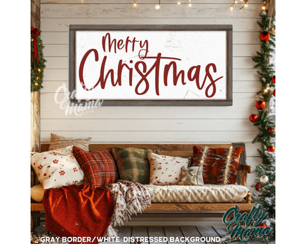 a merry christmas sign hanging on a wall above a couch