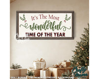 a picture of a christmas sign hanging on a wall