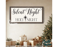 a sign that says silent night and a christmas tree