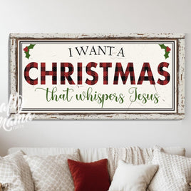 A Christian Christmas sign above a white couch sitting in a living room next to a christmas tree