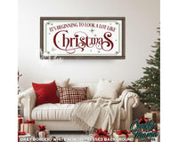 a living room with a white couch and christmas decorations