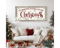 a living room with a couch and christmas decorations