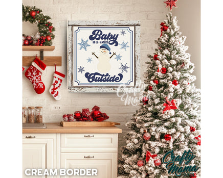 a white christmas tree sitting next to a white brick wall