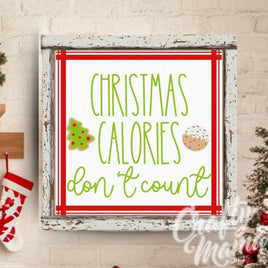 a decorated christmas tree in a kitchen