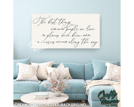 a living room with a blue couch and a quote on the wall