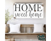 a wooden sign that says home sweet home