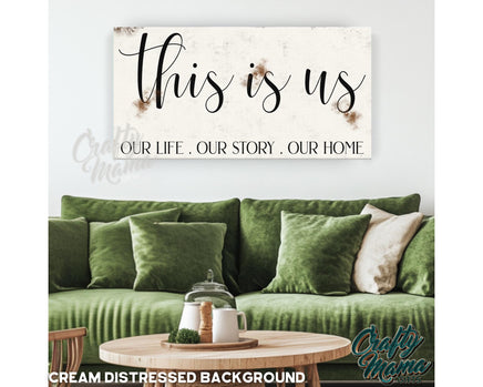 a living room with a green couch and a sign that says, this is us