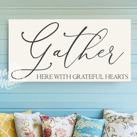 a sign that says gather here with grateful hearts