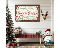 a christmas scene with a snowman and a santa claus sign