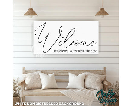 a welcome sign hanging on the wall of a living room