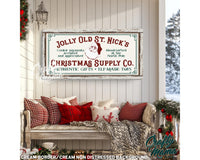 a picture of a christmas supply sign hanging on a wall