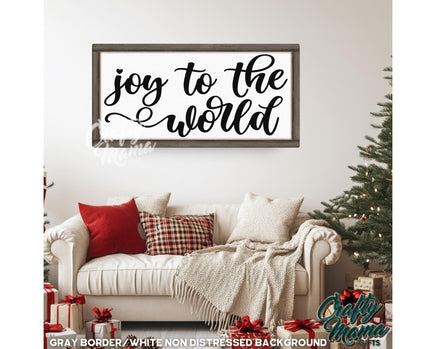 a living room with a white couch and a christmas tree