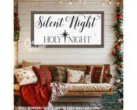 a wooden bench sitting under a sign that says silent night holy night