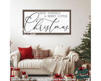 a living room with a white couch and a christmas tree