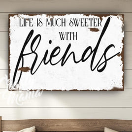 a wooden sign that says, life is much sweeter with friends