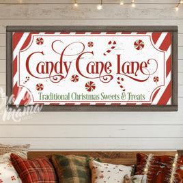 a picture of a candy cane sign hanging on a wall