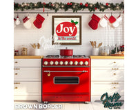 a red stove top oven sitting inside of a kitchen