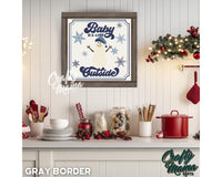 a framed picture of a snowman on a wall