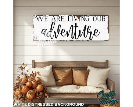 a wooden sign that says we are living our adventure