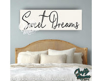 a bedroom with a bed and a sign that says sweet dreams