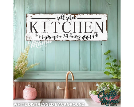 a kitchen sign hanging on the wall above a sink