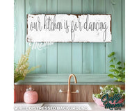 a sign that says our kitchen is for dancing