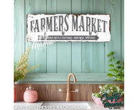 a sign that says farmers market above a kitchen sink