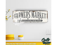 a sign that says farmers market hanging on a wall