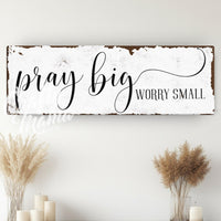 a wooden sign that says, prog big worry small