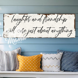 a bench with pillows and a sign on the wall