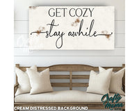 a sign that says get cozy stay awhile