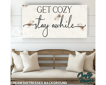 a sign that says get cozy stay awhile