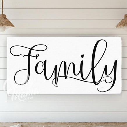 a family sign mounted on a wall above a couch