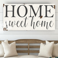 a wooden sign that says home sweet home