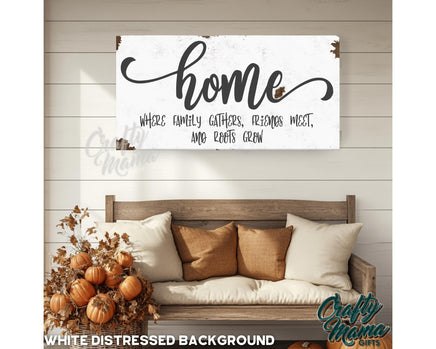 a wooden sign that says home with a couch in front of it