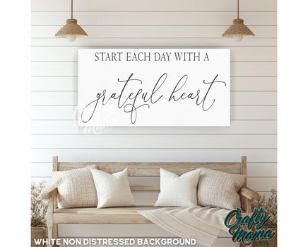 a white wall with a sign that says start each day with a grateful heart